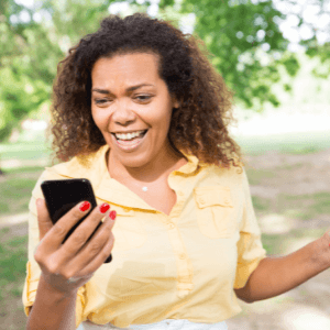 Woman creating a live video using her cell phone